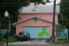 Pink house with colored garage door